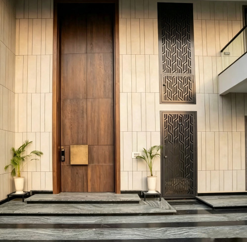 Custom Extra-Tall Aluminium Pivot Doors Transform Villa Facade Aesthetics